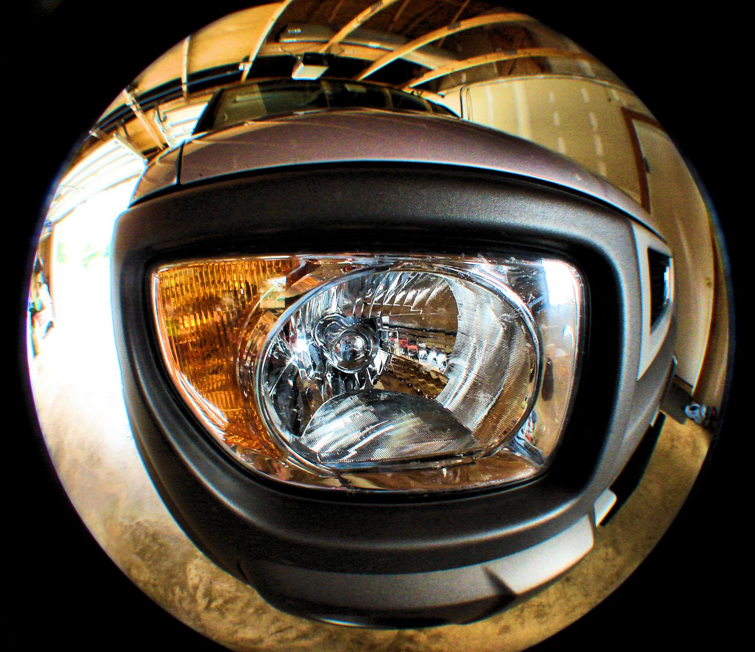 fisheye view of the front headlight of a Honda element - I bought my new car on the same day we bought the house - Tony Karp, design, art, photography, techno-impressionist, techno-impressionism, aerial photography , drone , drones , dji , mavic pro , video , 3D printing - Books -