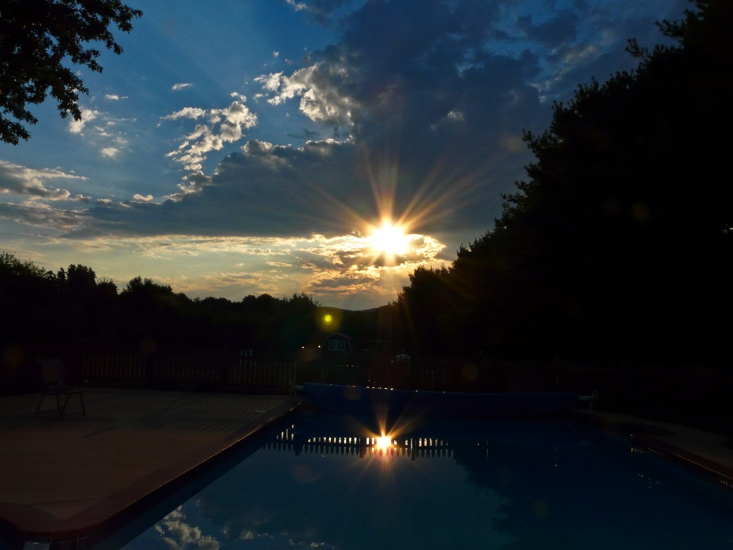 - I took this series of pictures about three weeks ago, just before I got my new DMC-FZ28, so this is sort of a swan song for my old faithful FZ18. It started about a quarter after 7pm, on a typical summer evening. This is behind my house, looking west. Looks like it's going to be a great sunset. But you can't get a wide view from here because of the trees that surround the property. So the Artist's Muse and I put on our walking shoes and headed out to our sunset-watching spot, about a mile away.<p></p>The journey you are about to see took about forty five minutes. I took 160 pictures to get the group you see here. - Sunset and the far-up lens -- Panasonic DMC-FZ18 - Tony Karp, design, art, photography, techno-impressionist, techno-impressionism, aerial photography , drone , drones , dji , mavic pro , video , 3D printing - Books -