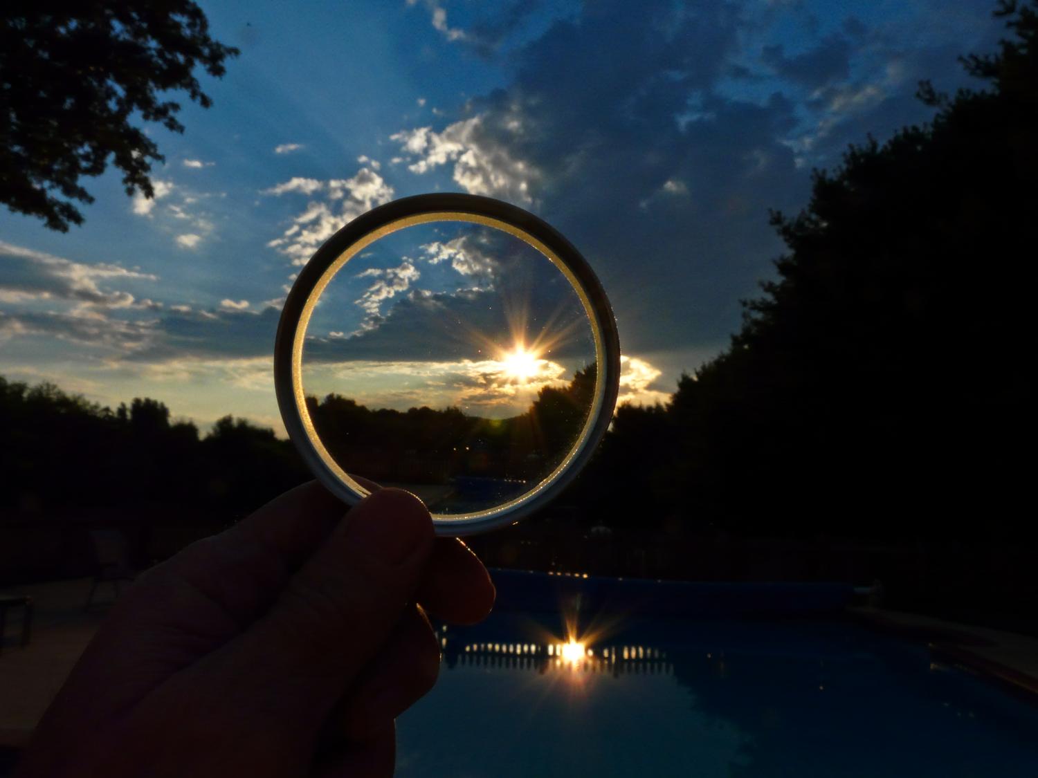  - But first, the far-up lens. This is actually a reducing glass, the opposite of a magnifying glass. It's a three inch diameter lens on a handle, just like  a regular magnifier. But when you hold it in front of something, it makes it smaller instead of larger. And that's why I call it my far-up lens -- it's the opposite of the close-up lens. One use is to hold it out in front of the camera as if you were holding it in front of your eyes. - Sunset and the far-up lens -- Panasonic DMC-FZ18 - Tony Karp, design, art, photography, techno-impressionist, techno-impressionism, aerial photography , drone , drones , dji , mavic pro , video , 3D printing - Books -