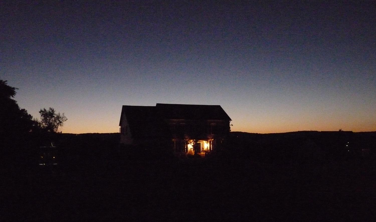sun setting behind a house with the lights on - After sunset - Panasonic DMC-FZ28 - Tony Karp, design, art, photography, techno-impressionist, techno-impressionism, aerial photography , drone , drones , dji , mavic pro , video , 3D printing - Books -